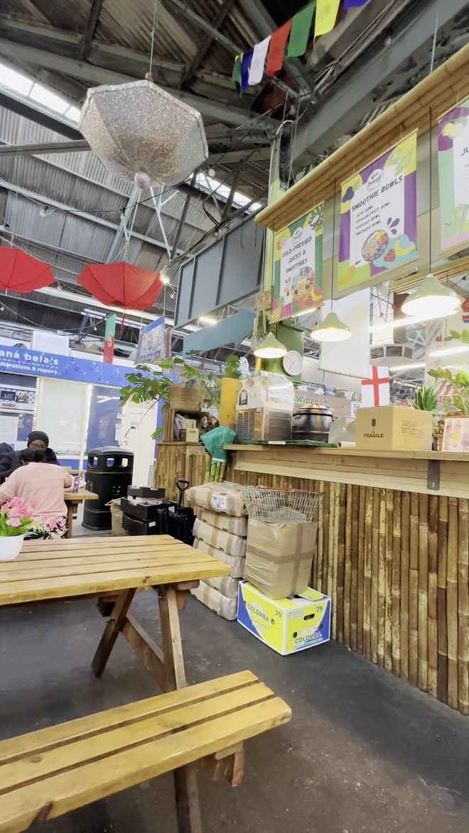 Picnic bench seating beside the stall